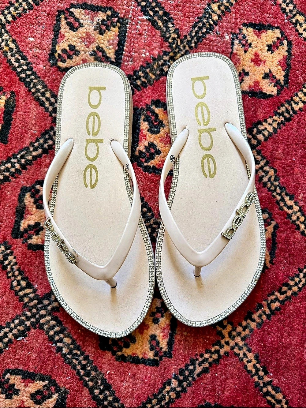 bebe Embellished Flip Flop Sandals in Cream